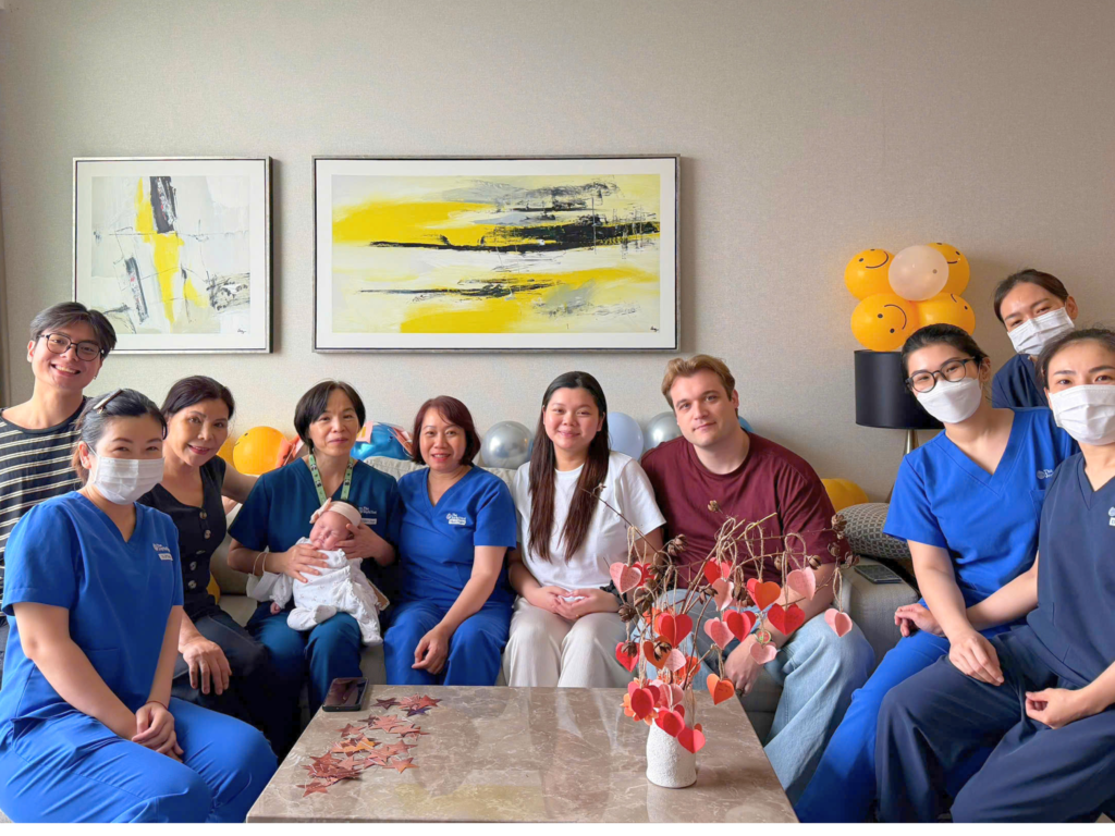 The whole family gathered for a keepsake photo by the Tree of Love, where heartfelt wishes were shared for baby Sushi.